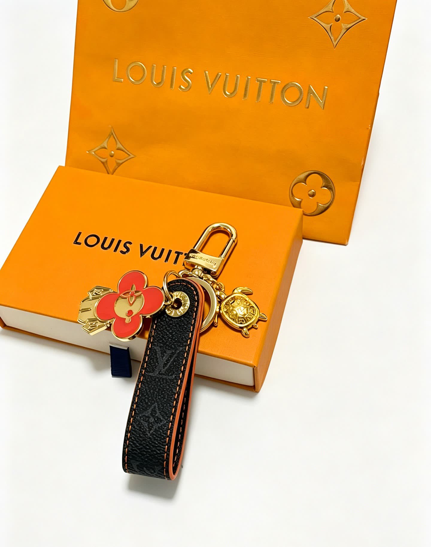 Louis Vuitton Leather Keychain with Flower and Turtle Charm